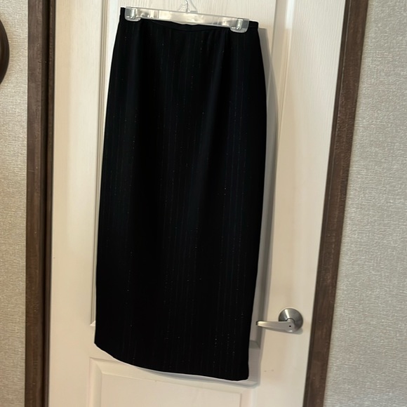 Straight black, pinstripe skirt, back zipper and back slit. - Picture 1 of 3